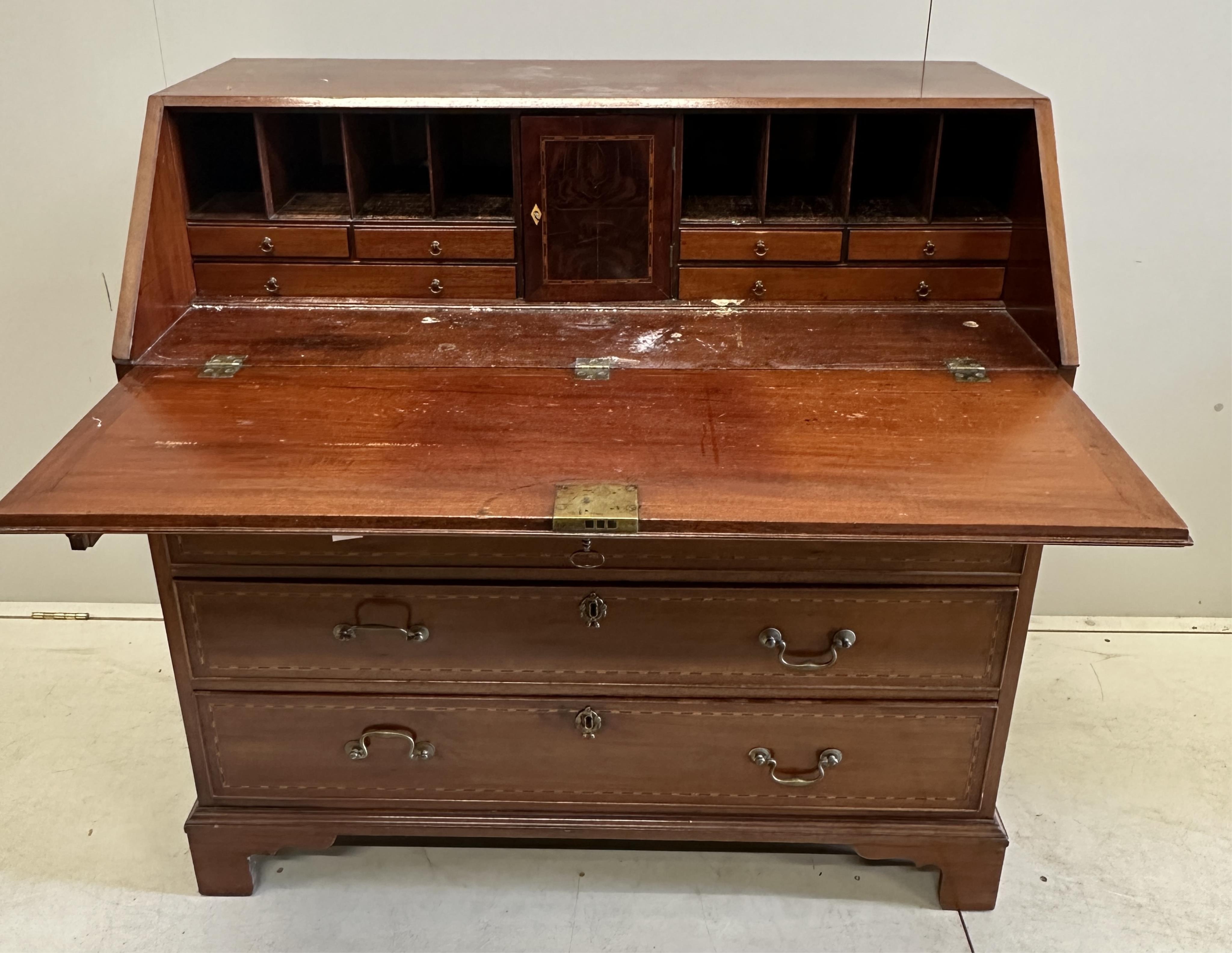 A George III mahogany bureau, width 108cm, depth 54cm, height 107cm. Condition - good, interior fair